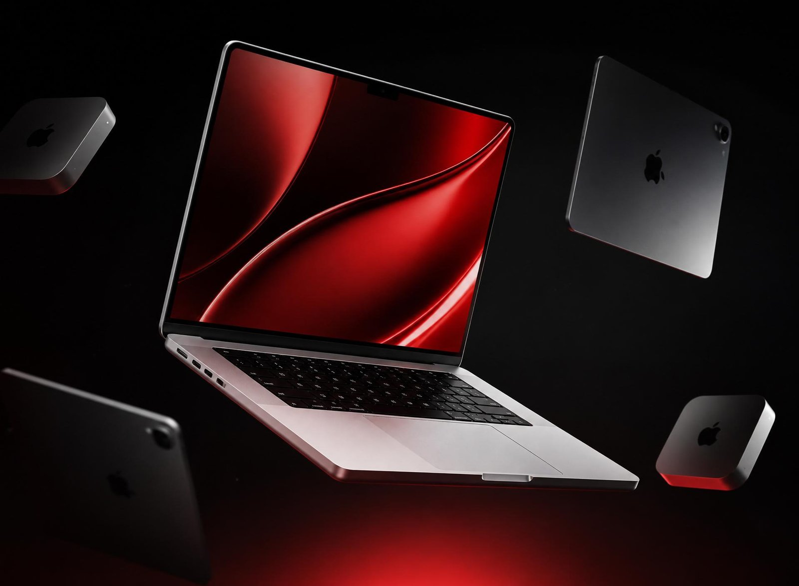 Floating MacBook, iPad and Mac Mini on premium dark background